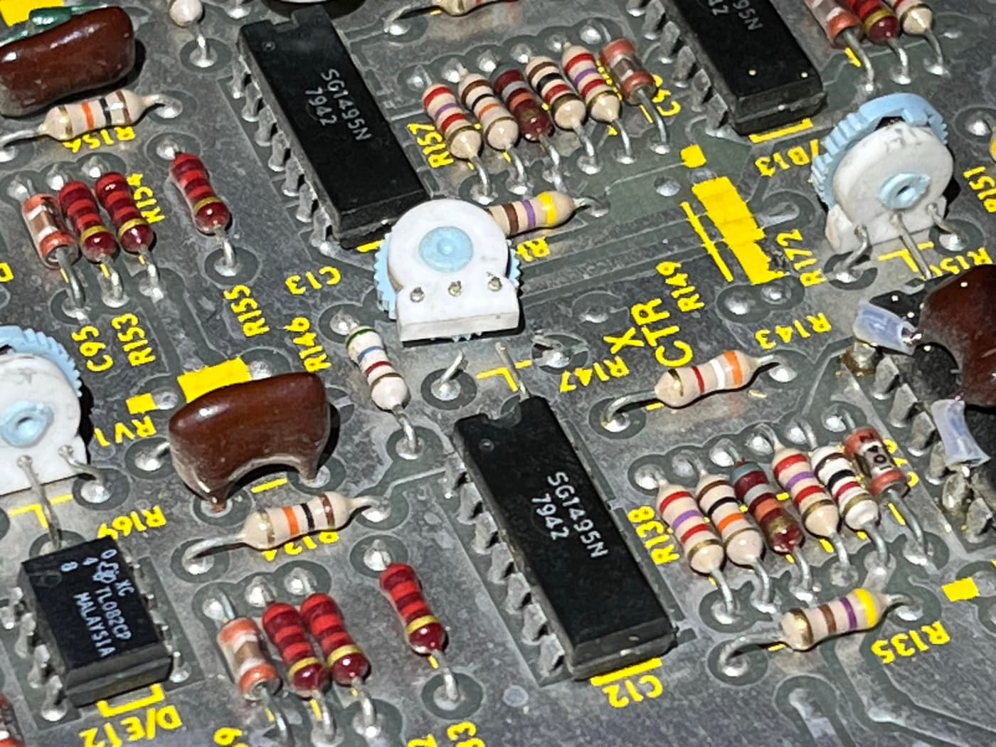 Close-up of circuit board with broken potentiometer